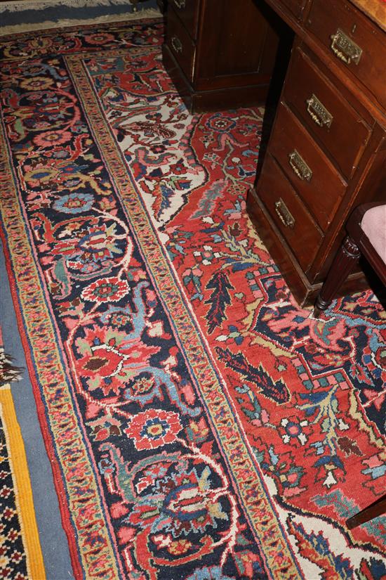 A Heriz red ground carpet, 350 x 258cms